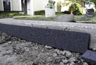 A Rubberific Expansion Joint placed against a curb