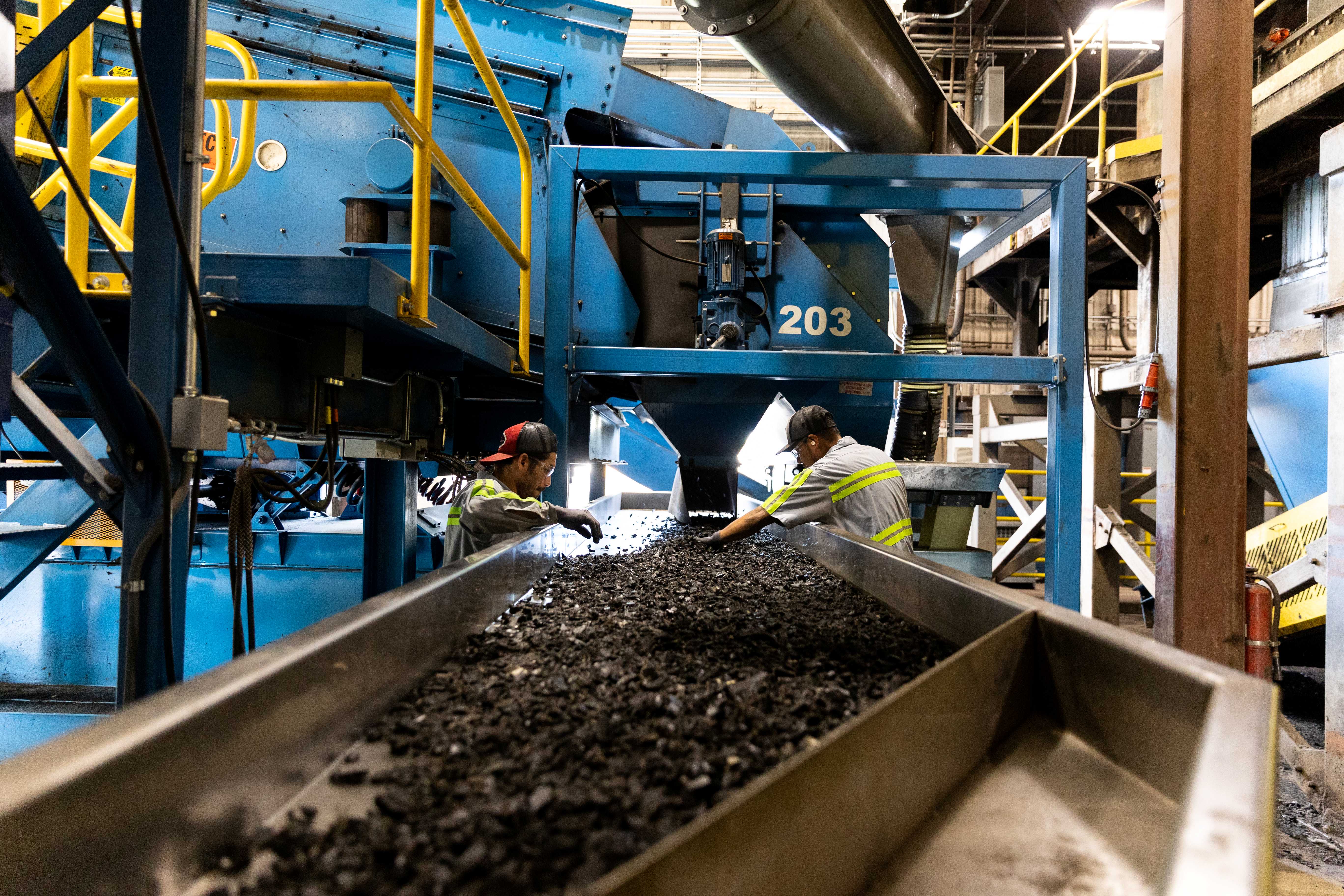 Liberty Tire Recycling - Employees with Tire Shredding Equipment