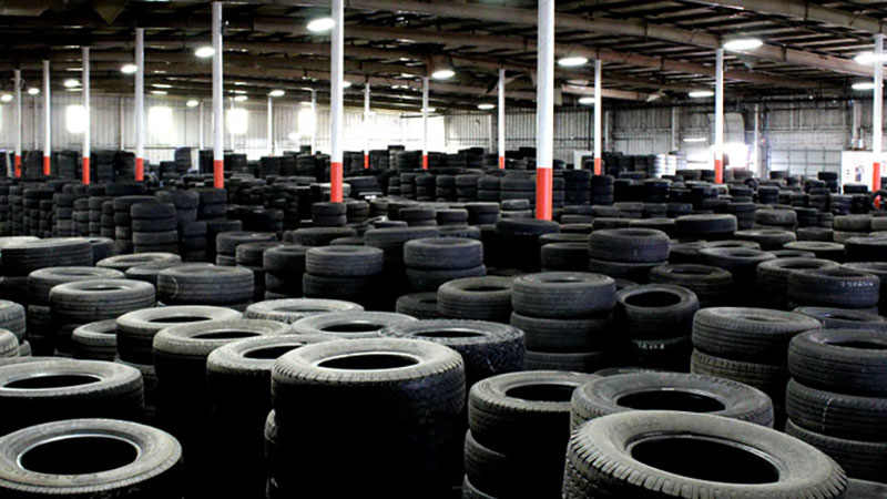 A warehouse filled with stacks of tires
