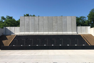 A concrete building using tire-derived aggregate as backfill