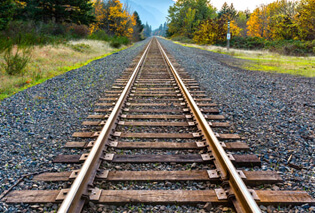 Railroad tracks laid out on rubber asphalt