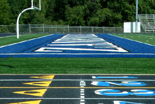 Rubber turf covering a track and field