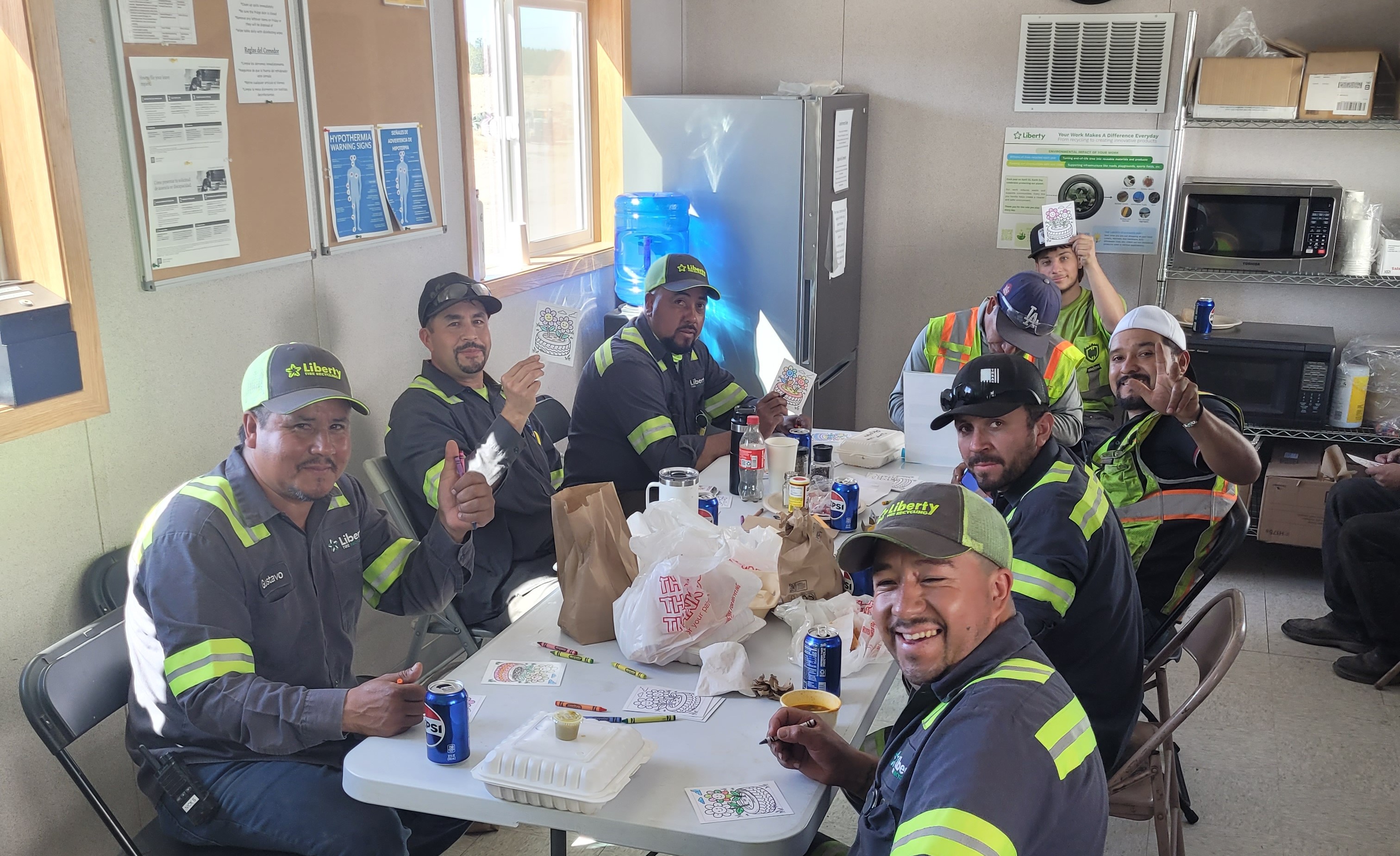 Liberty employees in Oregon write notecards for Blessings In A Backpack.