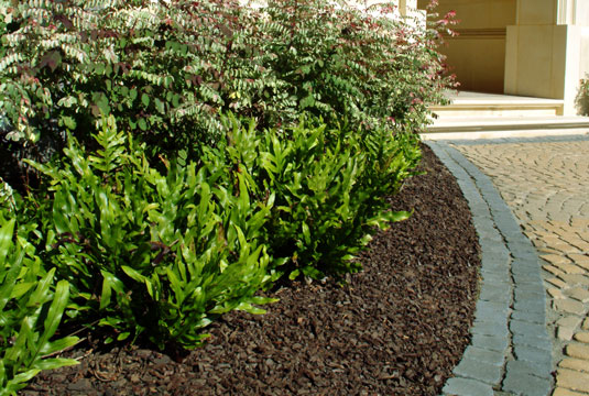 GroundSmart Rubber Mulch Nuggets in landscaping.