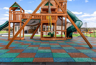 A playground with Playsafer Elevate Tile installed