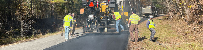 SmartMix being applied to a road by workers