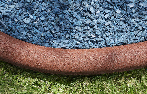 Rubberfic timber borders surrounding blue rubber mulch