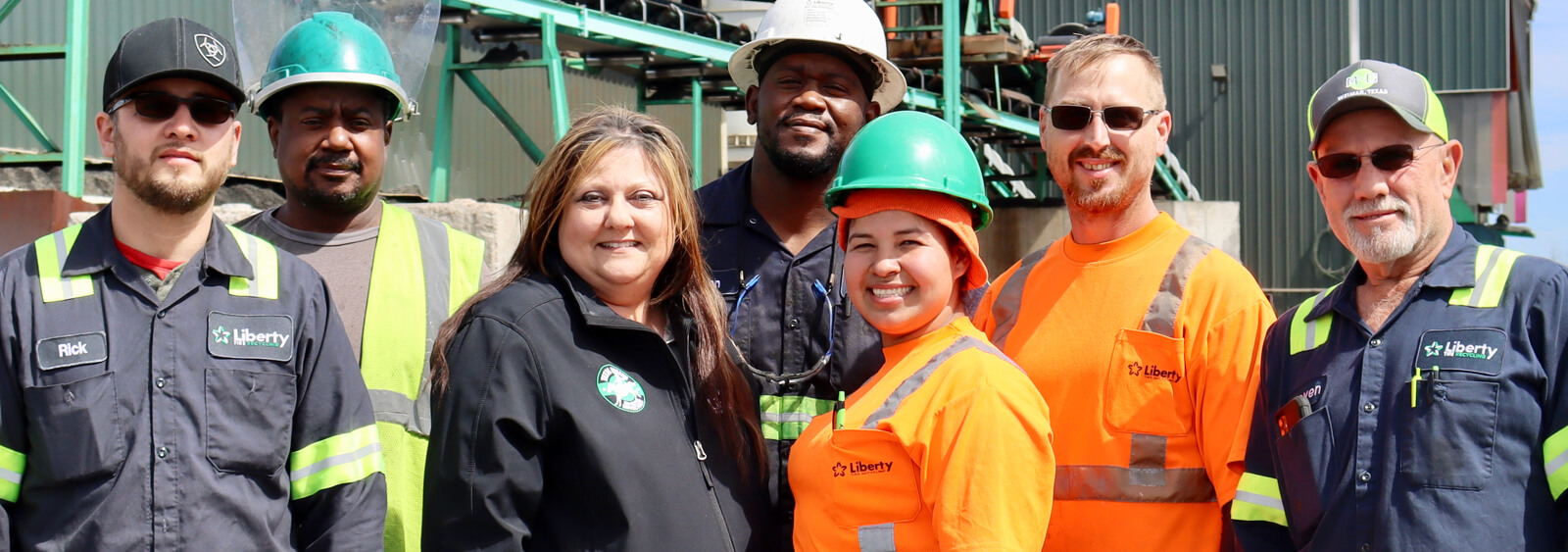 The Liberty Tire Recycling team standing outside a warehouse