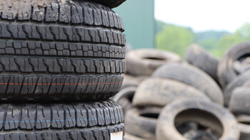 A stack of used tires outside